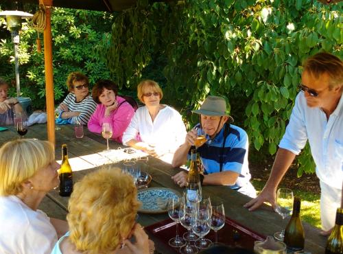 Guests and host Ian enjoying lunch in the garden at Akaunui in Canterbury