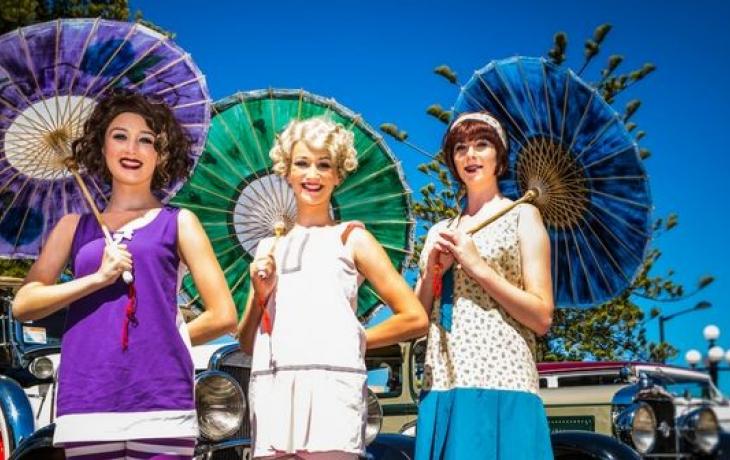 Ladies in Colourful Art Deco Dress and Vintage Cars at the Hawkes Bay Art Deco Festival