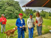 Colourful visitors, host and dog at Akaunui Gardens in Canterbury
